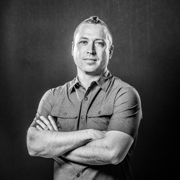 Justin Lindh - Granular Vice President, Paid Media black and white headshot
